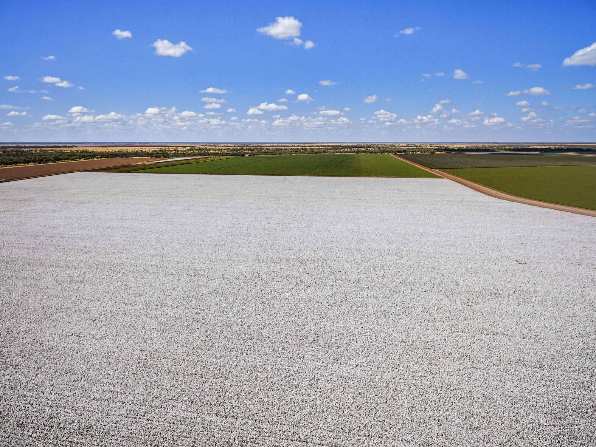 Agricultural field with GPS equipment and farming machinery